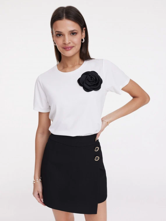 White blouse with rose embellishment