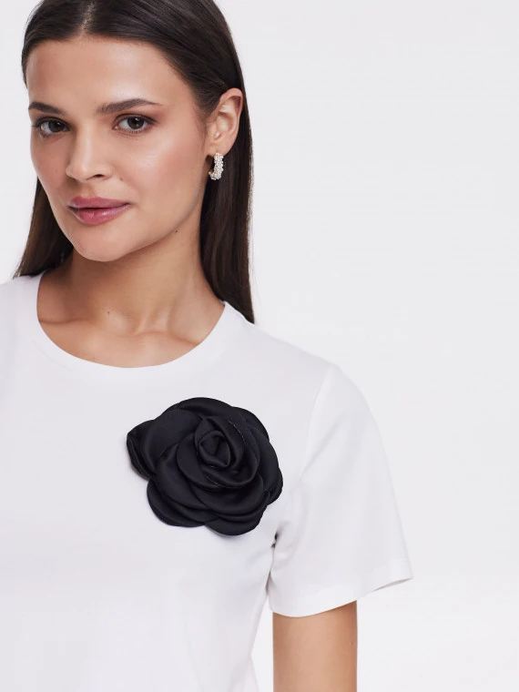White blouse with rose embellishment
