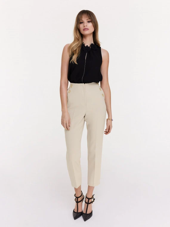 Beige cigarette pants with decorative buttons