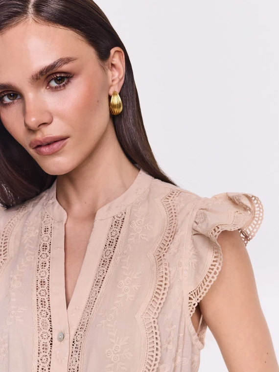 Beige button-down blouse with lace detailing