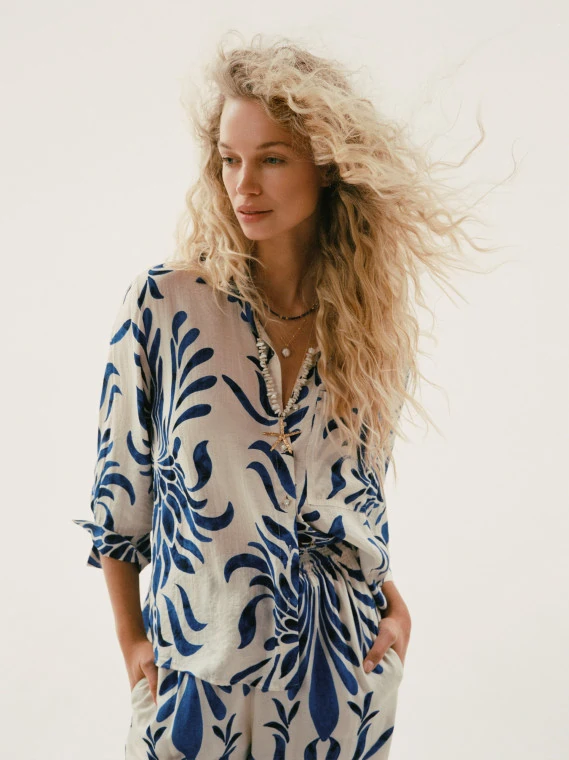 White oversized shirt with an ornamental pattern