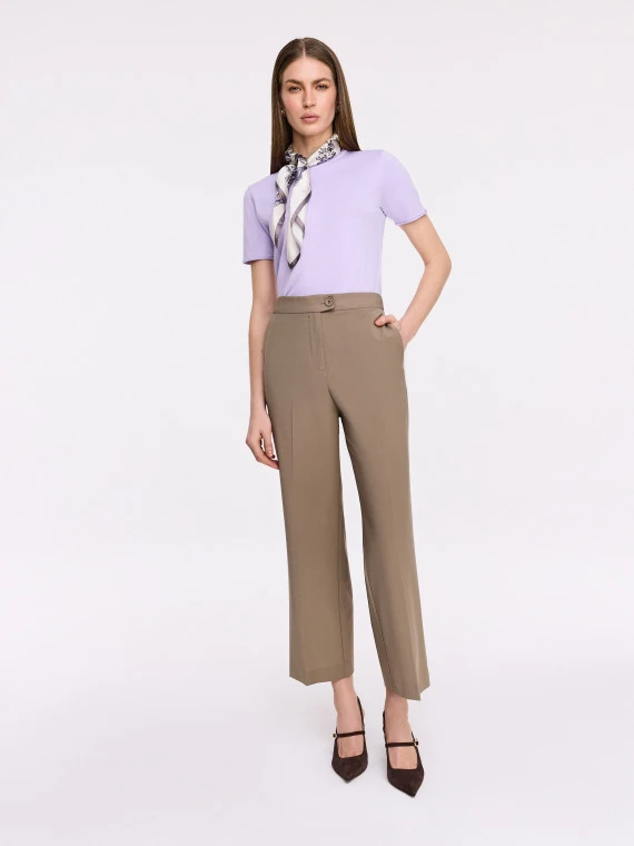 Simple beige pants with a high waist and ⅞ length legs