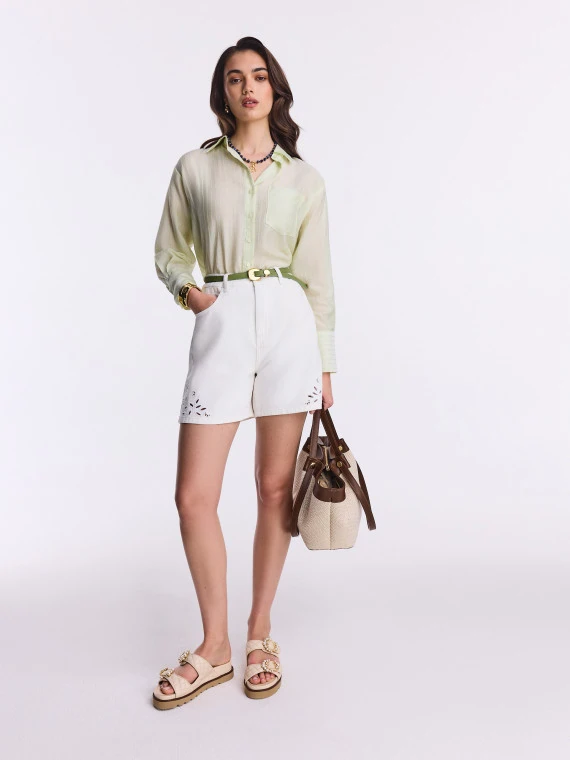 Short white denim pants with openwork decoration