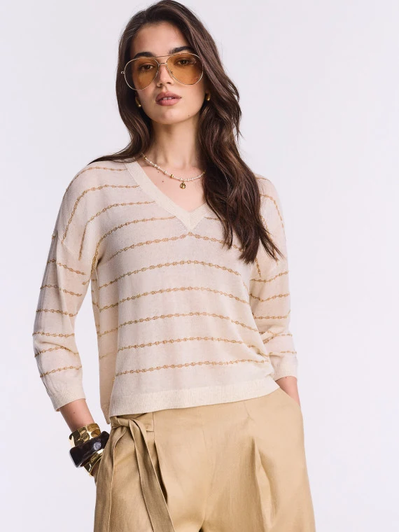 Light sweater with metallic embellishment