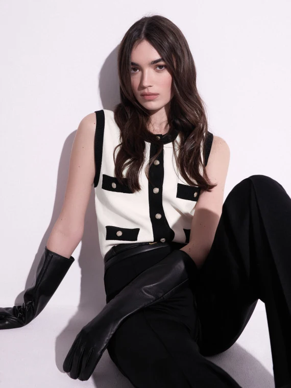 Creamy sleeveless top with contrasting details
