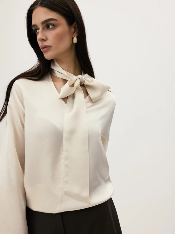 An elegant blouse with a sash in ecru