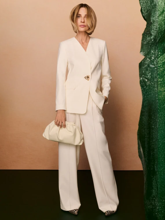Elegant cream trousers with a gold button