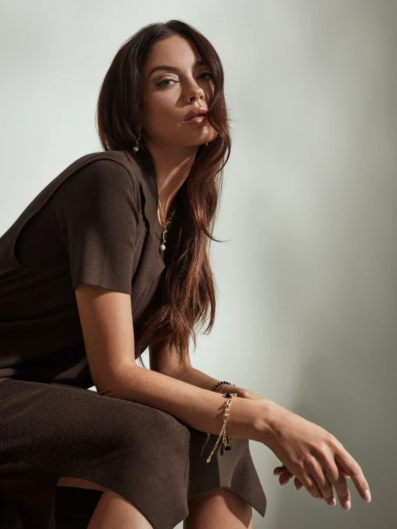 Long brown sleeveless sweater