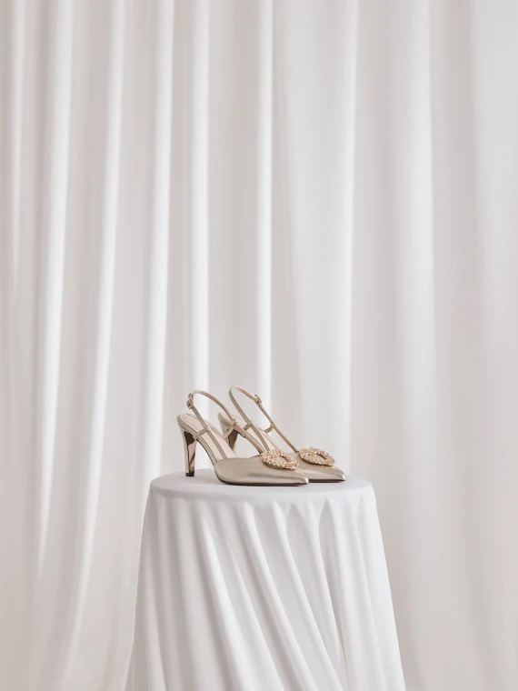 Gold pumps with open heel and embellishments