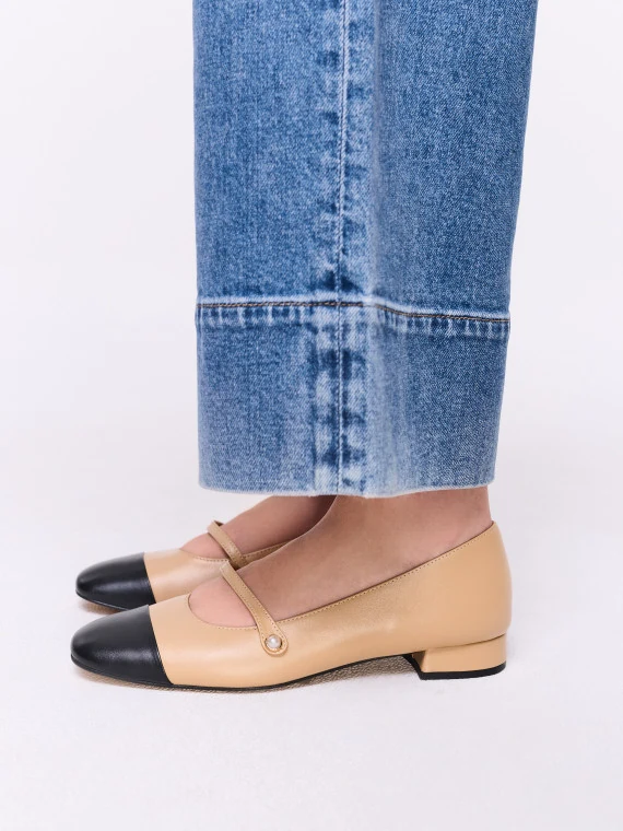 Two-tone leather ballet flats with a decorative strap
