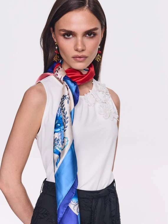 A silk scarf with blue and red flowers