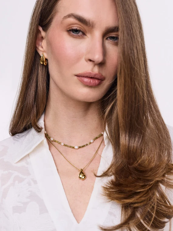 Double gold-plated necklace with pendant and green stones