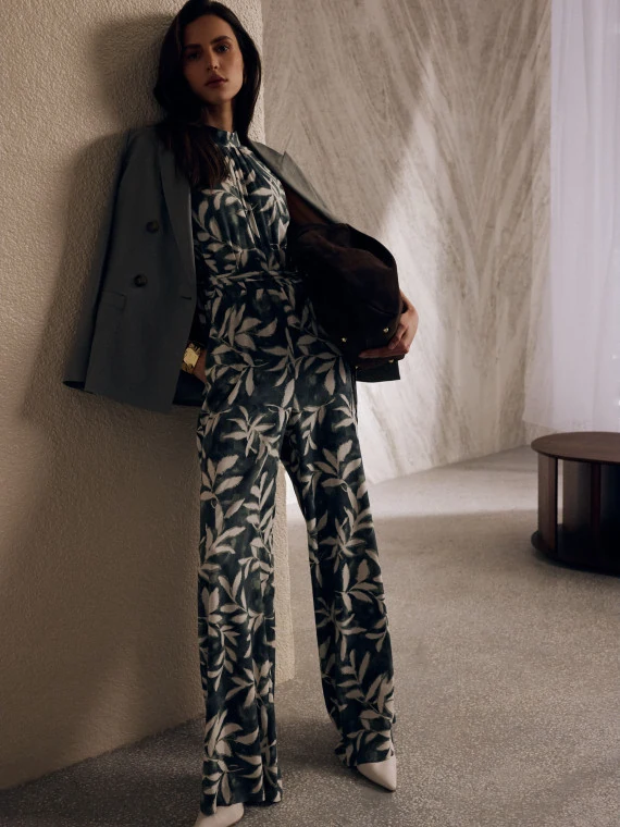 Long olive jumpsuit with a floral pattern
