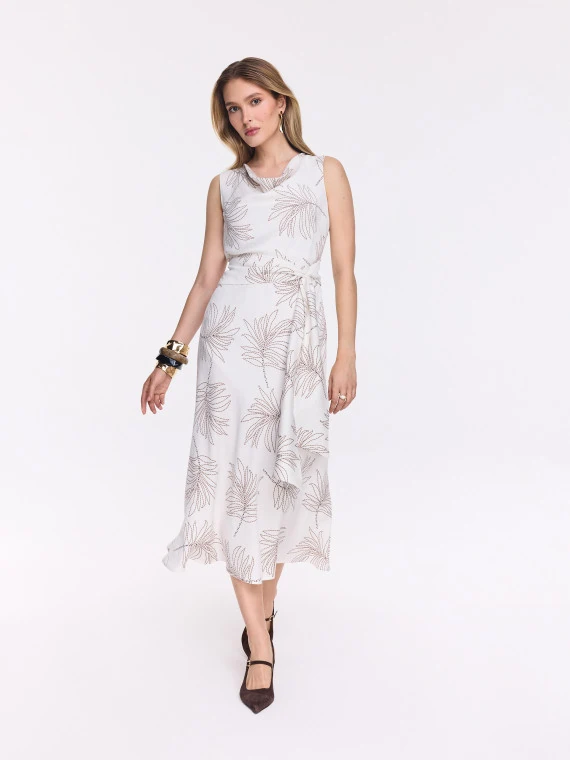 White midi dress with a leaf pattern