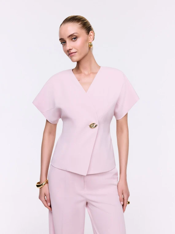 An elegant jacket with a decorative fastening