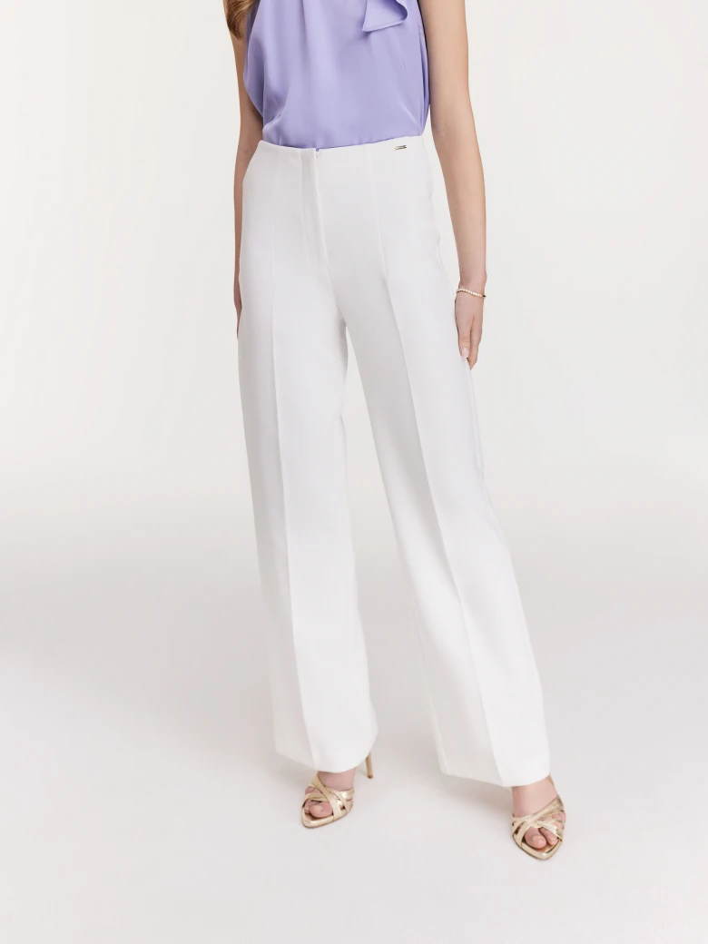 Elegant white pants with flared legs