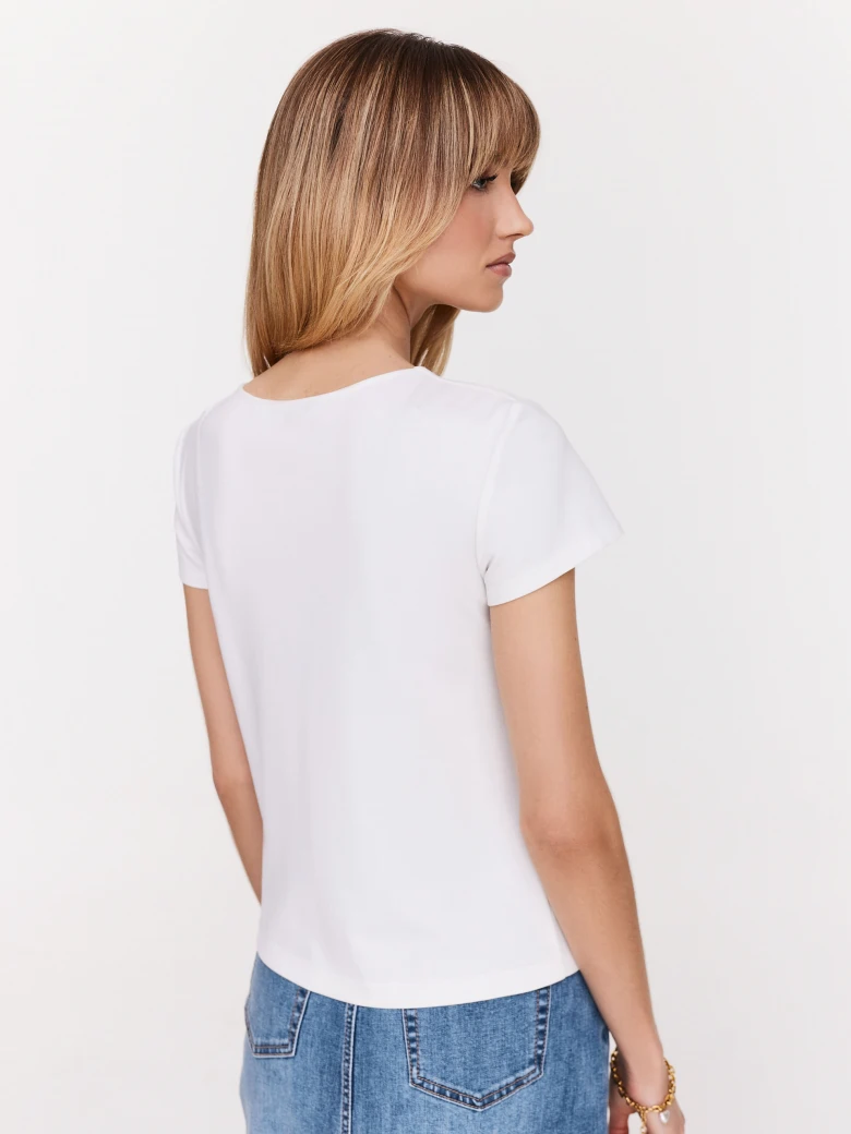 White blouse with a striking chainmaille