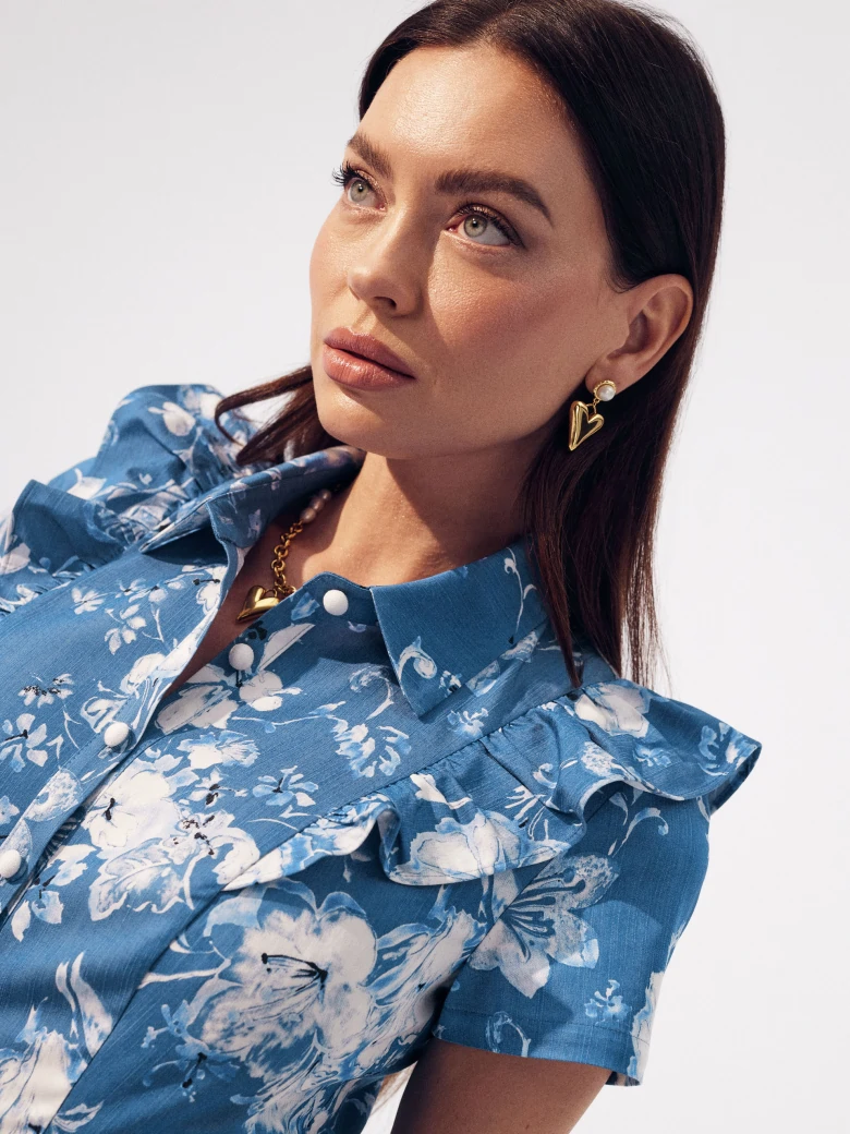 Blue emery type dress with white floral pattern
