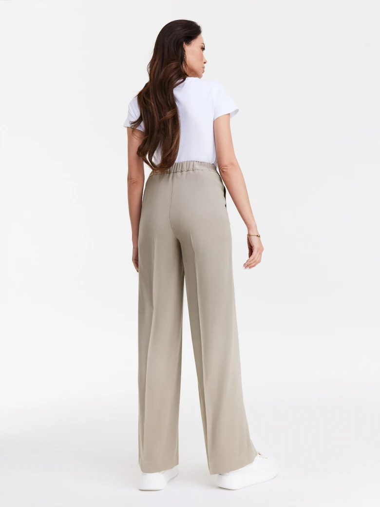 Beige pants with wide legs