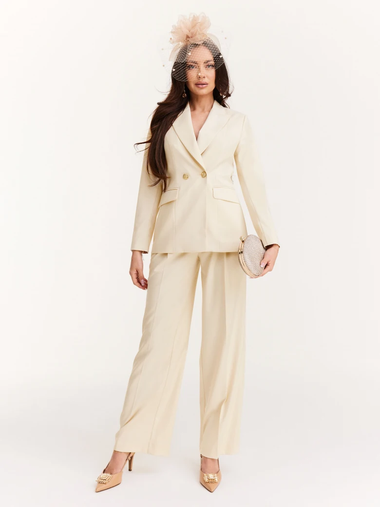 Cream suit jacket with decorative buttons