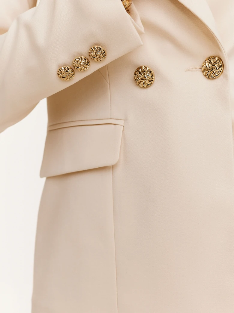 Cream suit jacket with decorative buttons