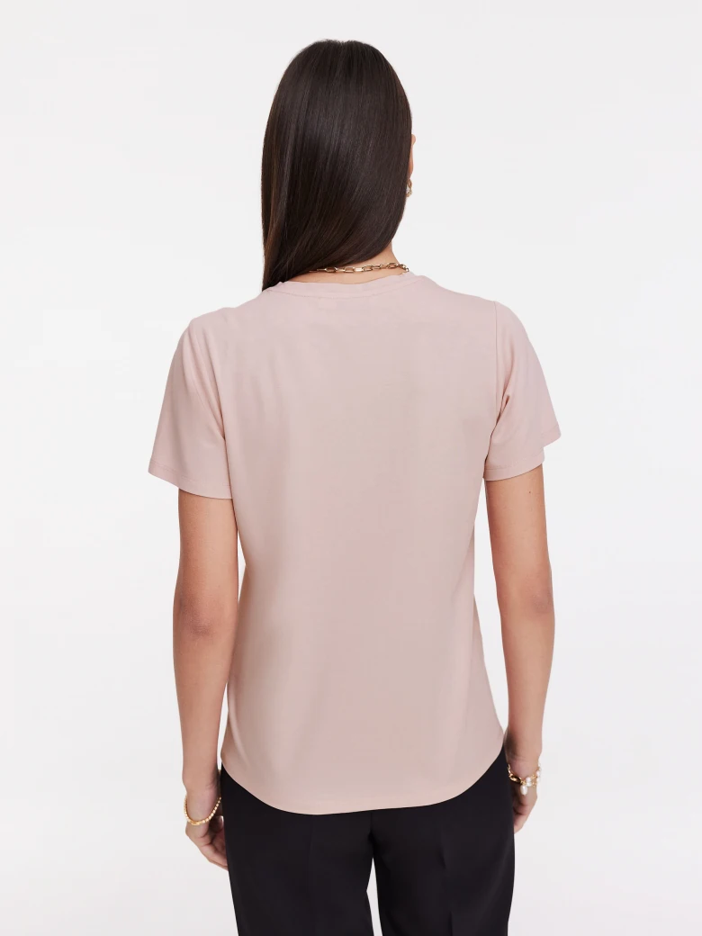Undersized pink blouse with rose embellishment