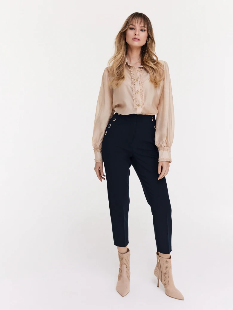 Navy blue cigarette pants with decorative buttons