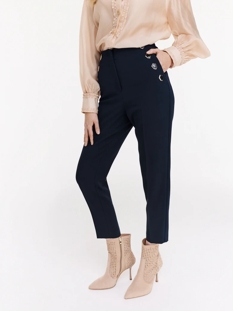 Navy blue cigarette pants with decorative buttons