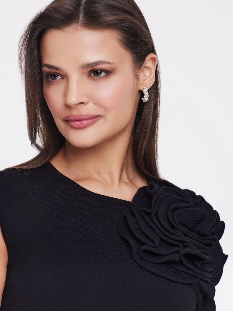 Black blouse with three-dimensional flower