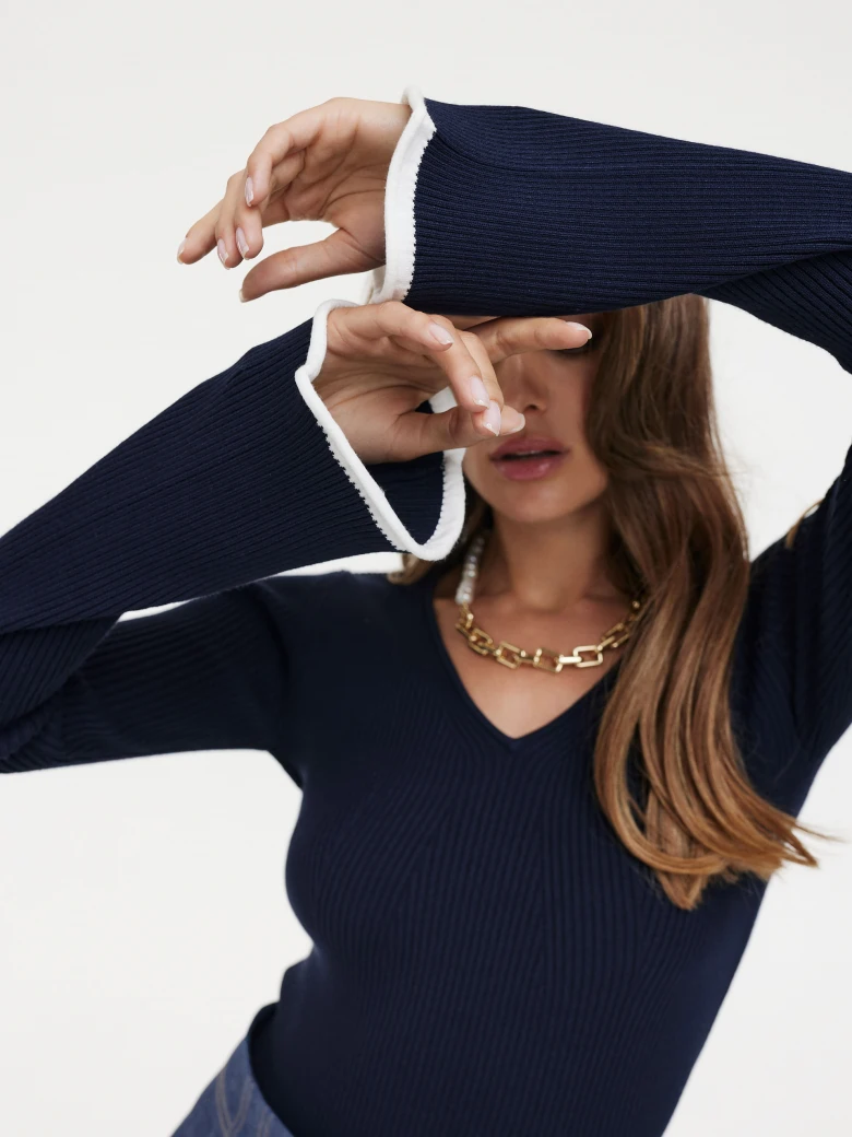 Navy blue sweater with flared sleeves