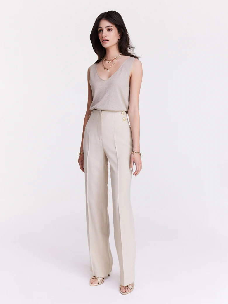 Knitted sleeveless jacket in beige color