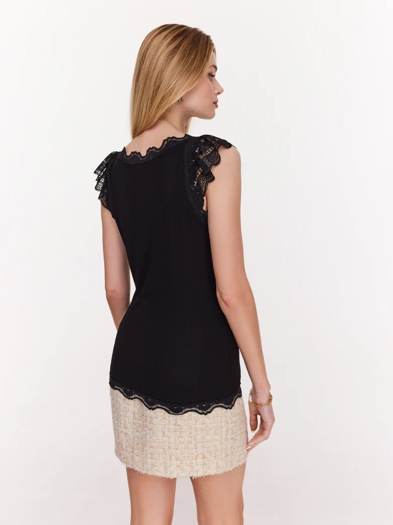 Black blouse with short sleeves and lace inserts
