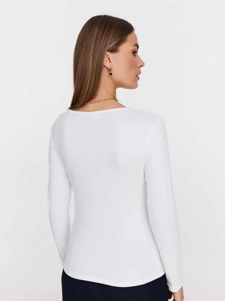 White blouse with striking cutouts