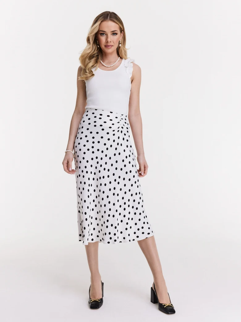 White top with shoulder strap embellishments