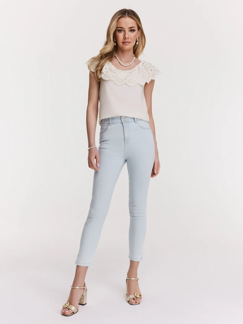 White blouse with lace embellishment at the neckline
