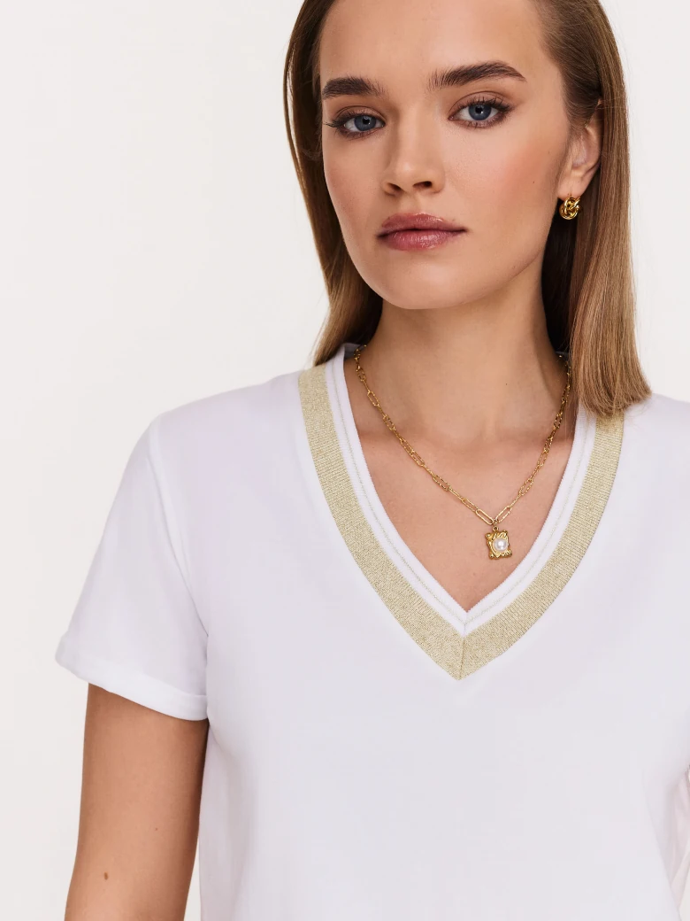 White blouse with piping and short sleeves