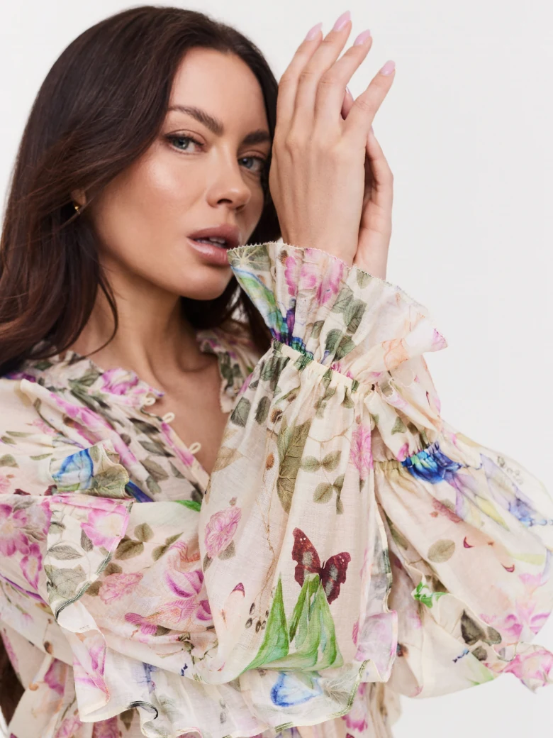 Beige blouse with colorful pattern with dragonflies