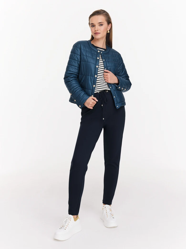 Navy blue quilted jacket with decorative buttons