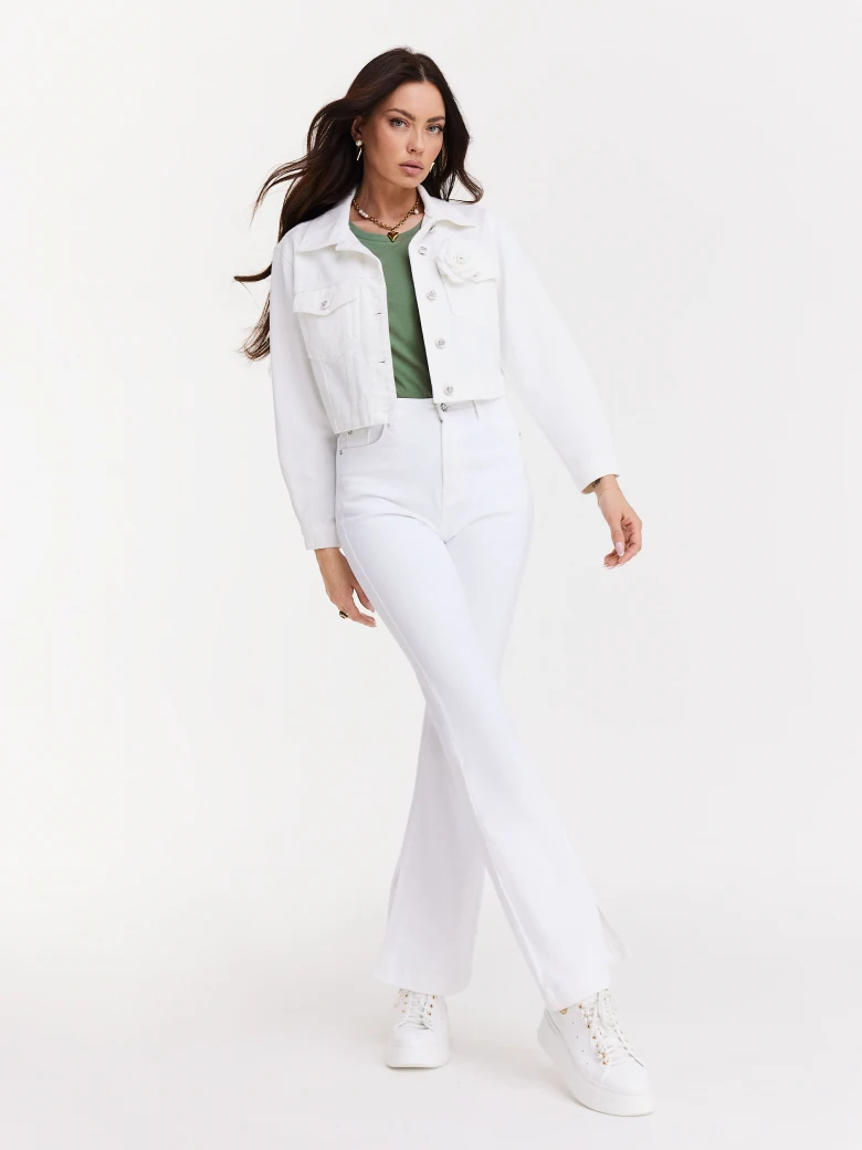 Short white jacket with decorative buttons and rose