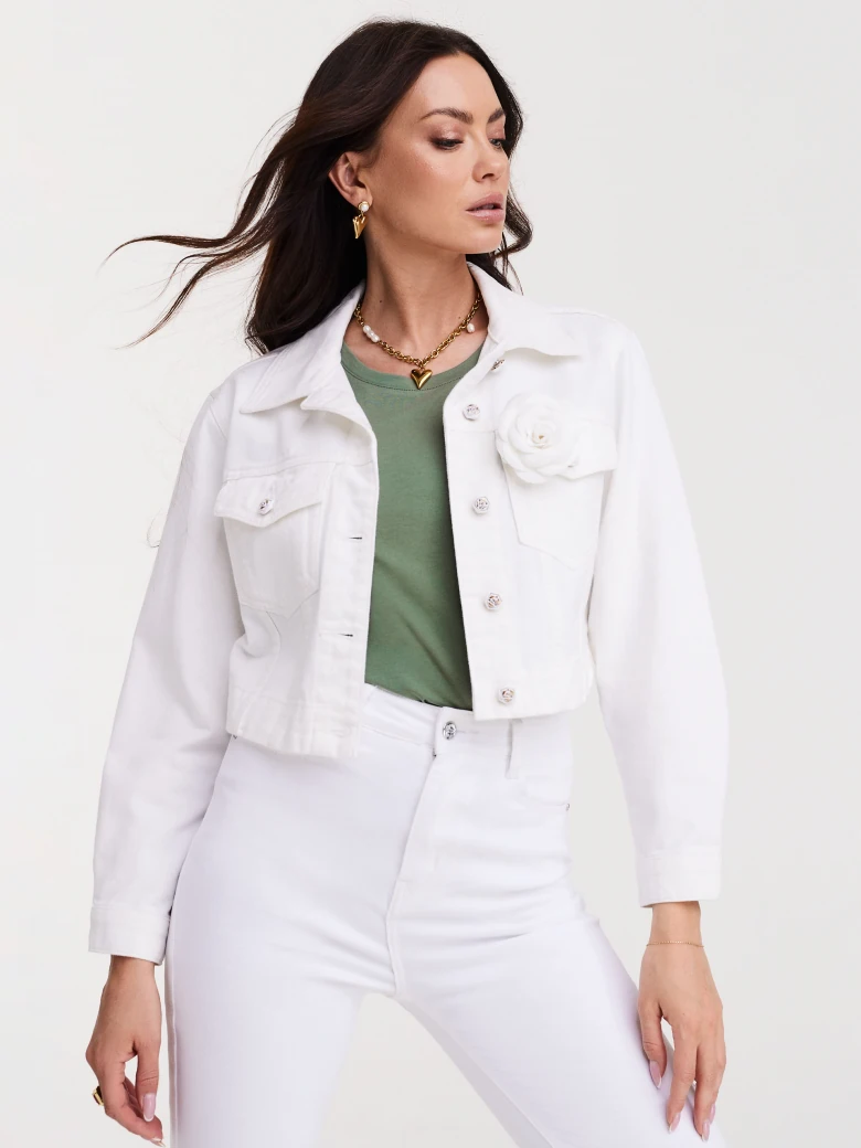 Short white jacket with decorative buttons and rose