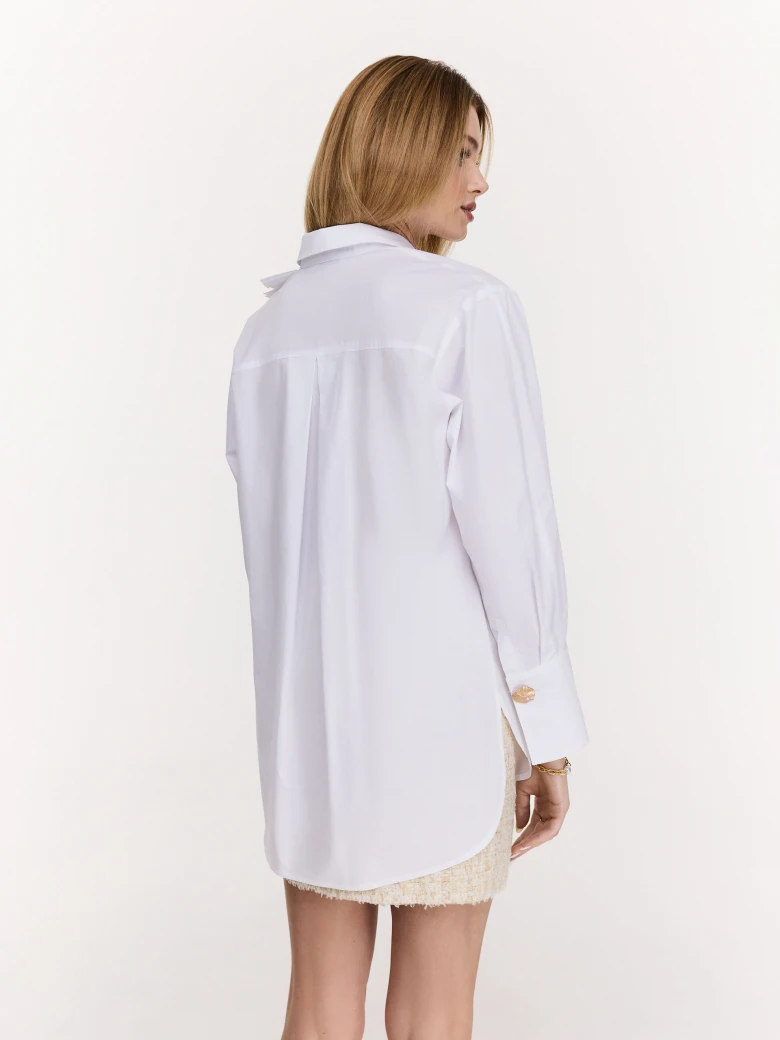 White cotton shirt with decorative ruffles