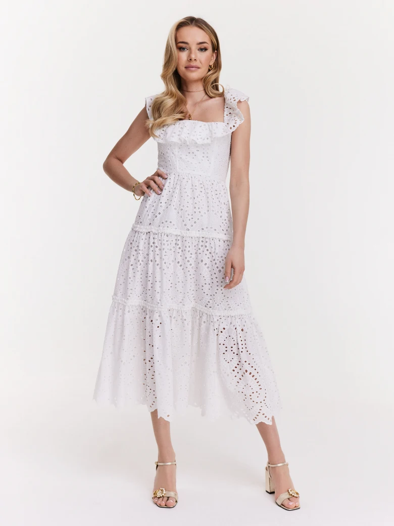 Delicate dress made of thin embellished fabric