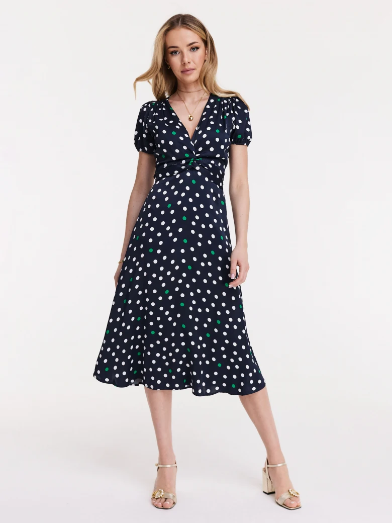 Navy blue dress with white and green peas