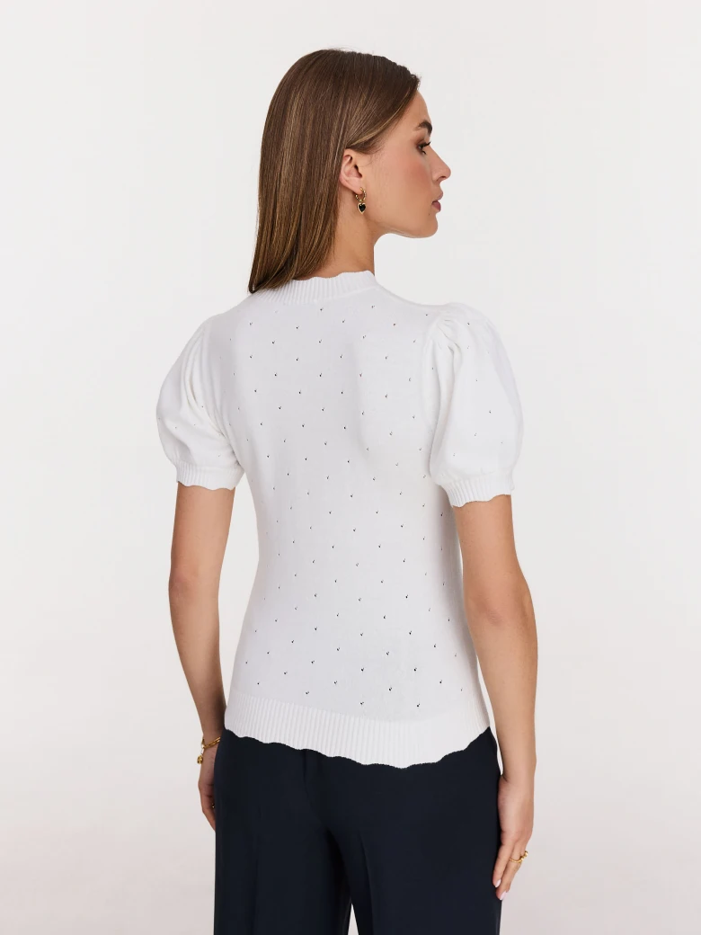 White buffet sweater with openwork embellishments