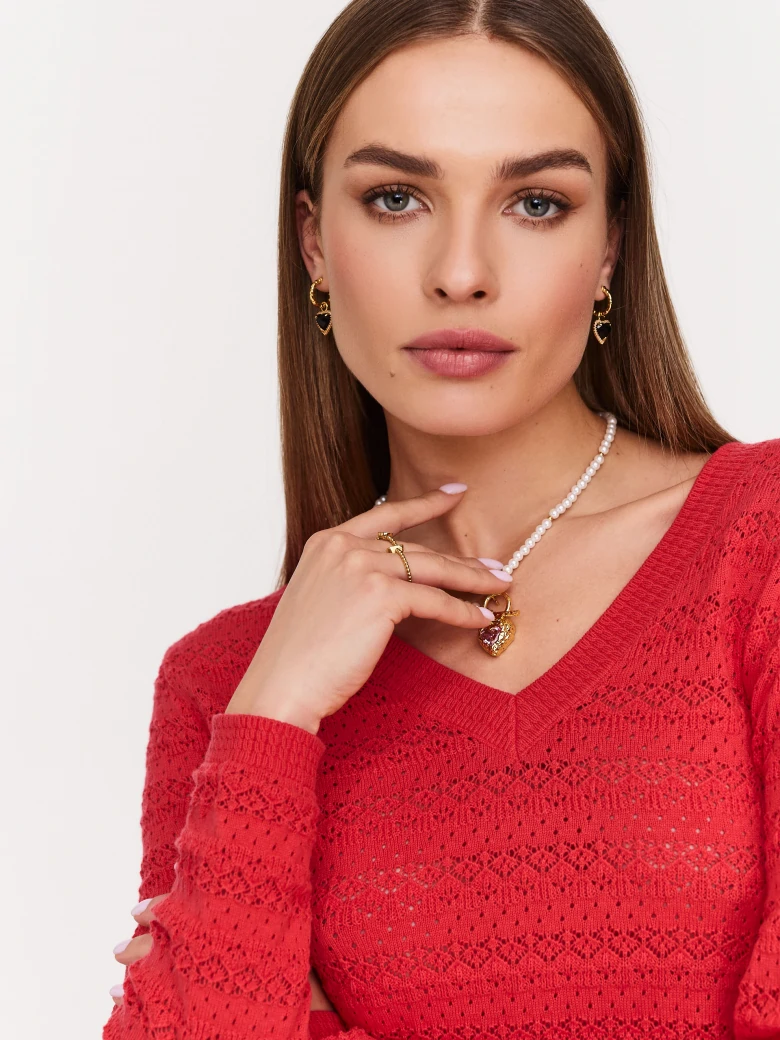 Red openwork sweater with V neckline