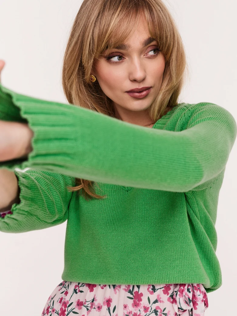 Green sweater with a heart neckline