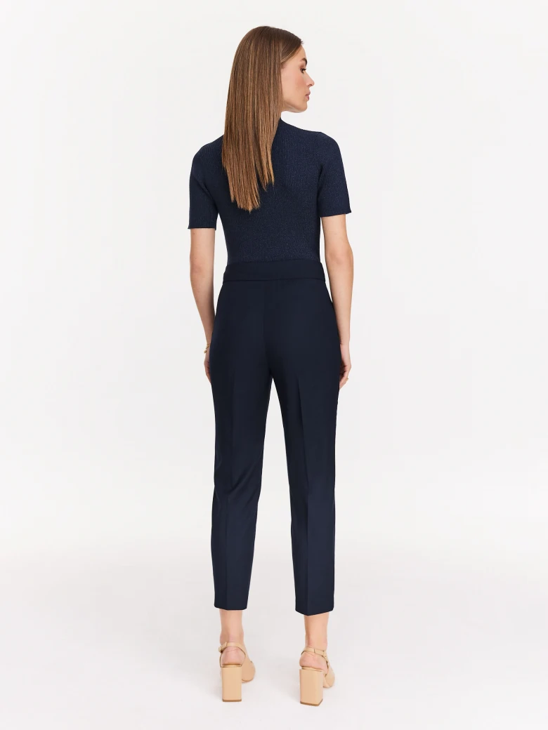 Navy blue sweater with floral appliqué