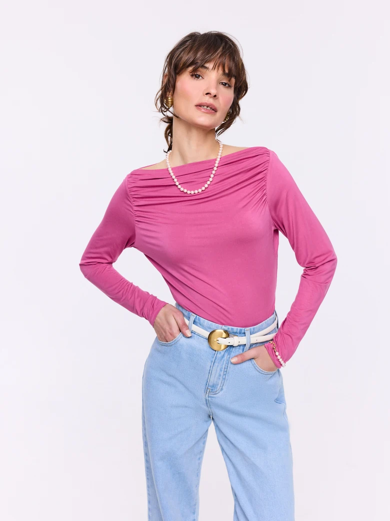 Pink blouse with ruffles and long sleeves