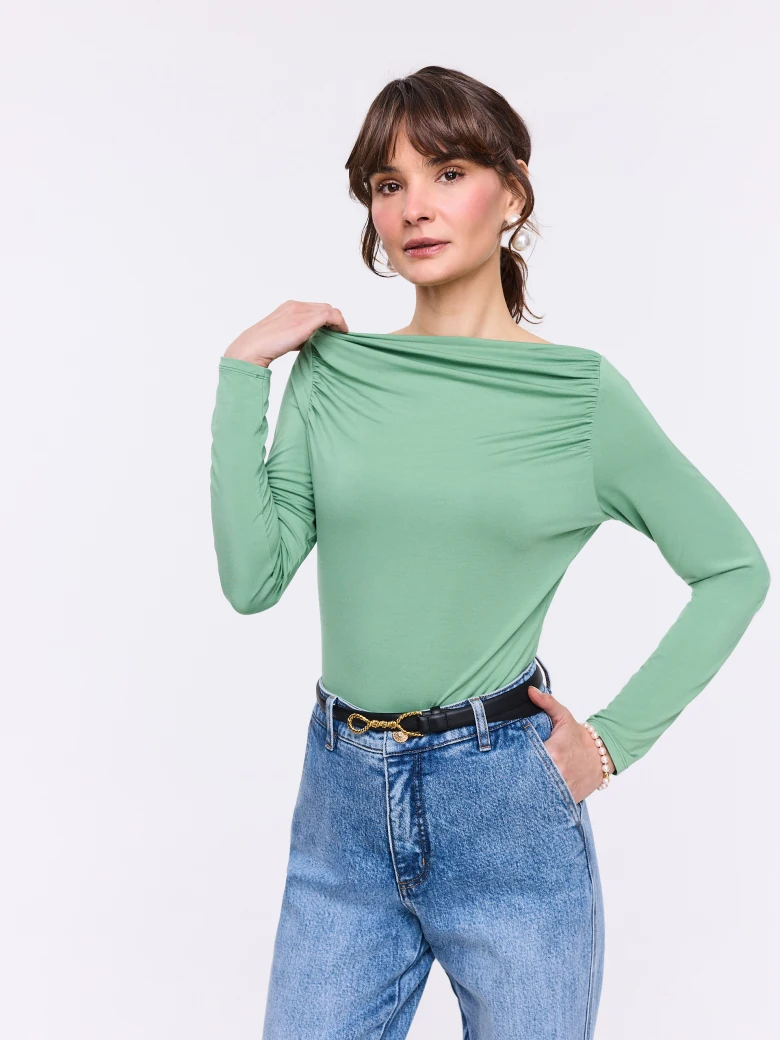 Light green blouse with ruffles and long sleeves