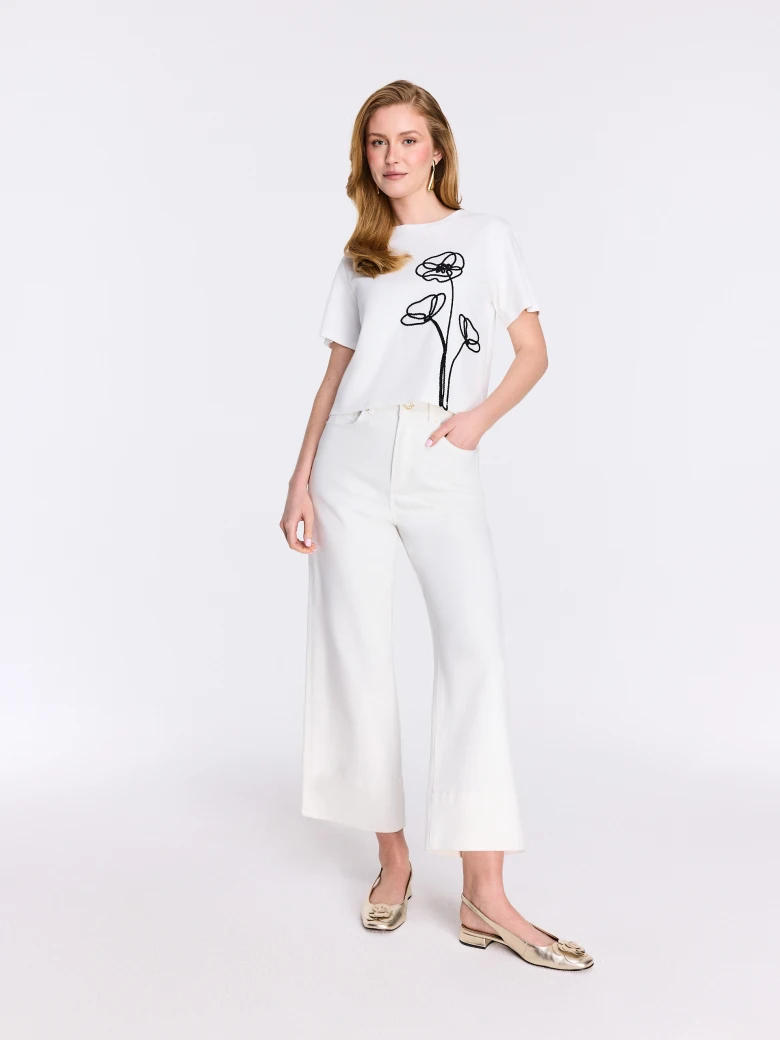 White cotton short-sleeve blouse with lace embroidery